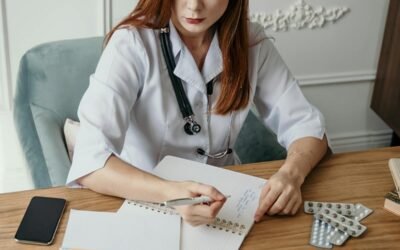 Medical student studying NEET books at a desk with stationery